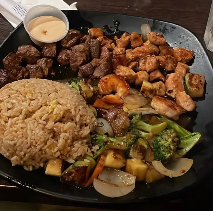Delicious hibachi cuisine prepared on a grill with fresh ingredients.