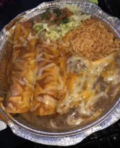 Delicious plate of enchiladas topped with cheese and fresh ingredients