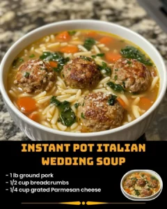 Delicious Instant Pot Italian Wedding Soup with meatballs and greens.