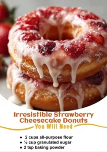 Delicious strawberry cheesecake donuts topped with icing and fresh strawberries