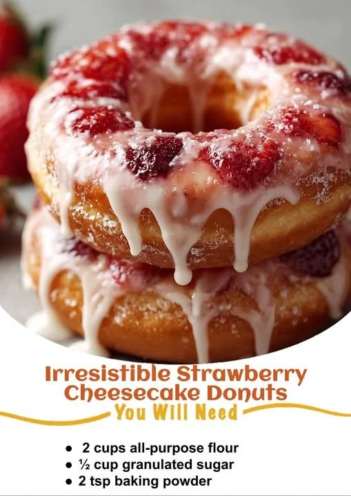 Delicious strawberry cheesecake donuts topped with fresh strawberries
