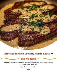 Juicy steak topped with creamy garlic sauce on a plate
