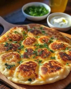 Delicious homemade Keto Naan bread on a wooden surface.