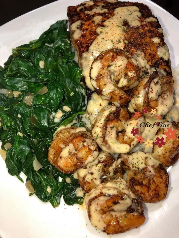 Keto Salmon and Shrimp with Garlic Spinach on a plate