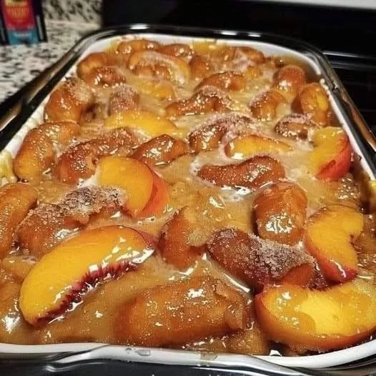 Krispy Kreme Peach Cobbler dessert, showcasing delicious peaches and crispy topping.