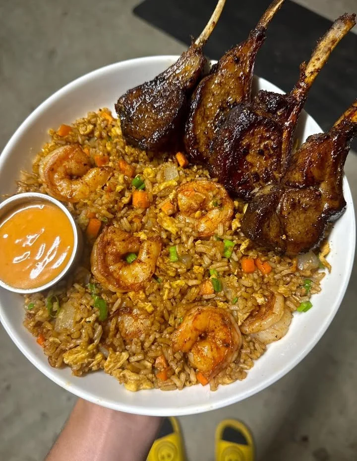 Lamb chops paired with shrimp fried rice, an enticing meal combination