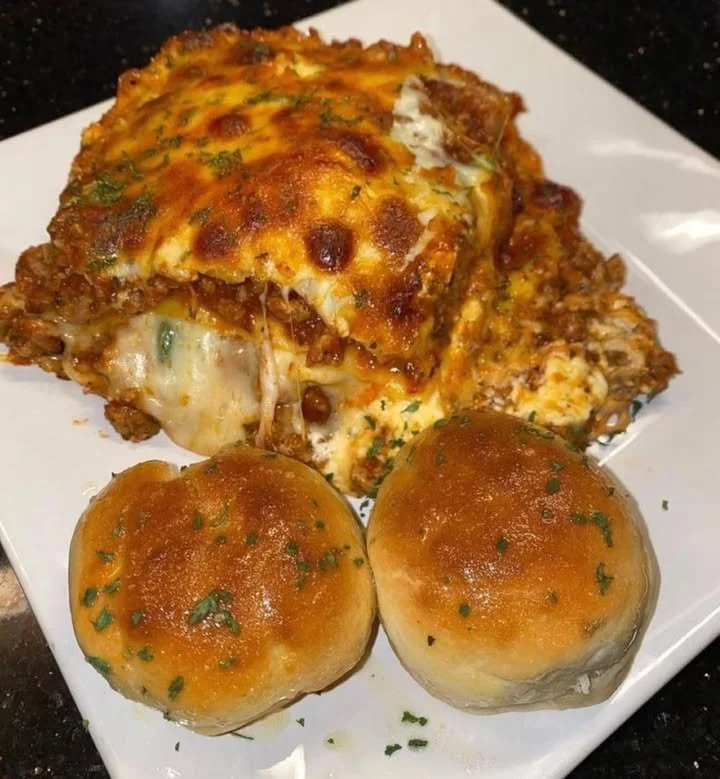 Delicious homemade lasagna with layers of cheese and rich meat sauce.
