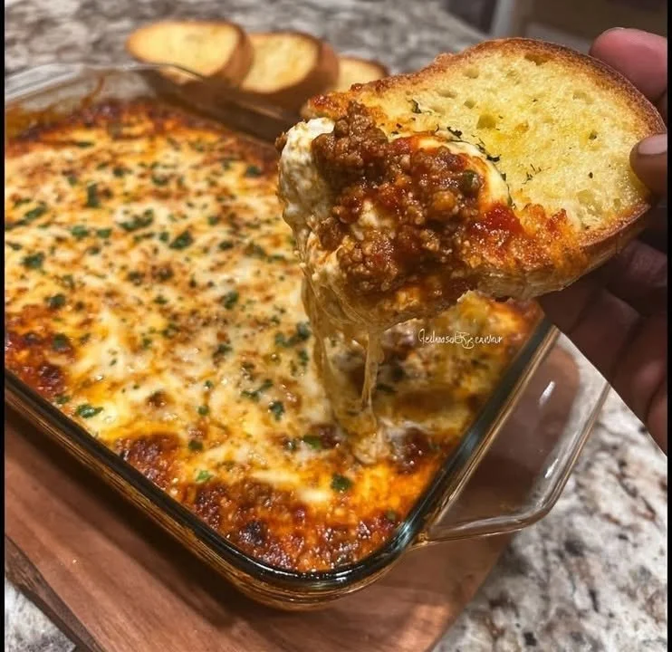 A cheesy and delicious Lasagna Dip served in a baking dish