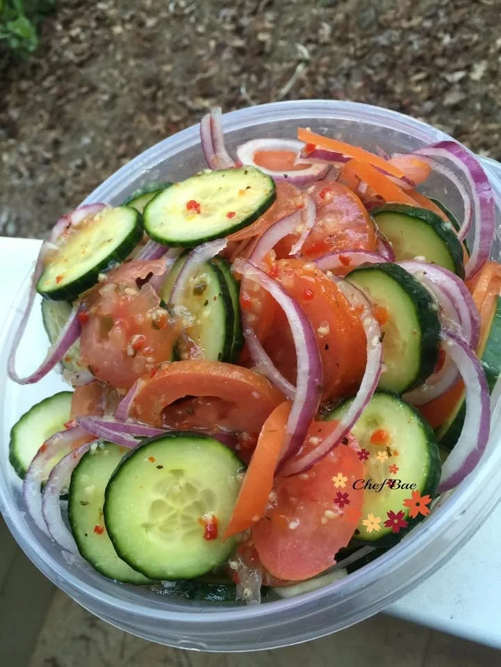 Variety of late night snacks including chips, fruits, and chocolates on a table