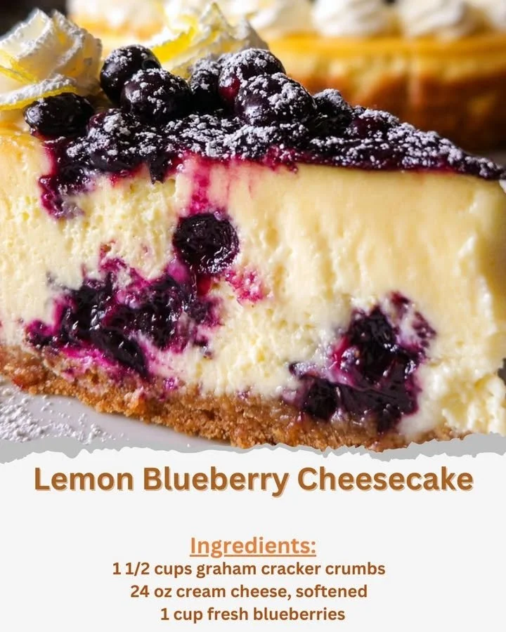 Slice of lemon blueberry cheesecake topped with fresh blueberries and lemon zest.