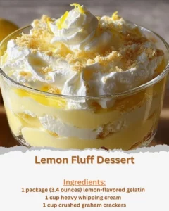 Lemon Fluff dessert garnished with lemon slices and whipped cream