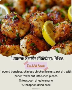 Plate of flavorful Lemon Garlic Chicken Bites with lemon wedges and herbs.