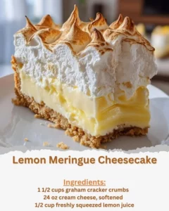 Slice of lemon meringue cheesecake topped with fluffy meringue on a plate