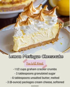 Slice of lemon meringue cheesecake topped with fluffy meringue and lemon zest