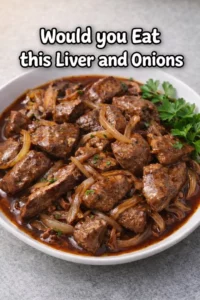 Plate of delicious liver and onions garnished with herbs
