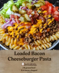 Bowl of loaded bacon cheeseburger pasta topped with cheese and bacon