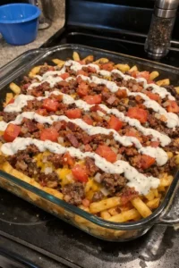 Loaded Bacon Ranch Cheeseburger French Fry Casserole ready to serve
