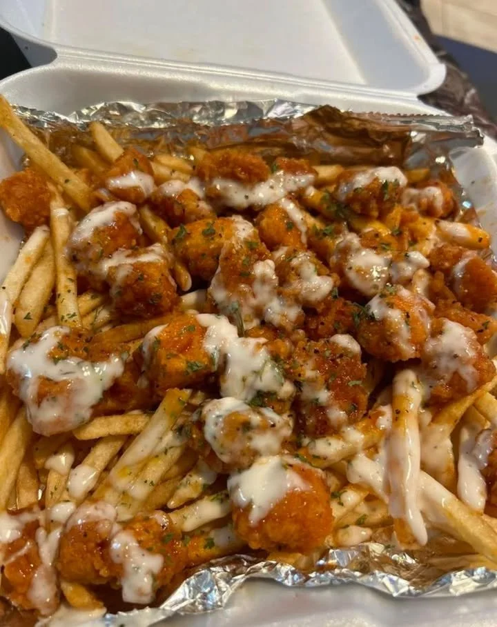 Delicious loaded fries topped with cheese, bacon, and toppings