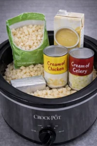 Bowl of creamy Loaded Potato Soup garnished with bacon, cheese, and green onions