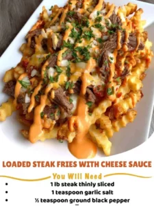 Loaded steak fries topped with cheese sauce, a delicious comfort food treat.
