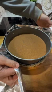 Decadent Lotus Biscoff Cheesecake topped with crushed Biscoff cookies