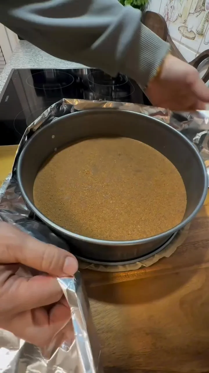 Decadent Lotus Biscoff Cheesecake topped with crushed Biscoff cookies