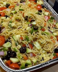 Colorful salad bowl with fresh vegetables and dressing