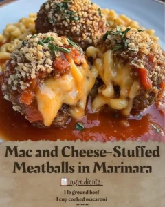 Delicious Mac and Cheese-Stuffed Meatballs served with marinara sauce
