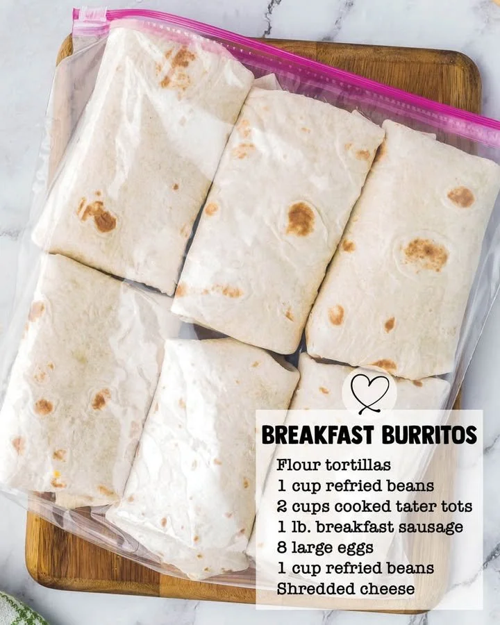 Make-ahead breakfast burritos filled with eggs, cheese, and vegetables.
