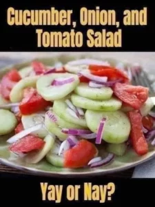 Fresh marinated cucumbers, onions, and tomatoes in a serving bowl