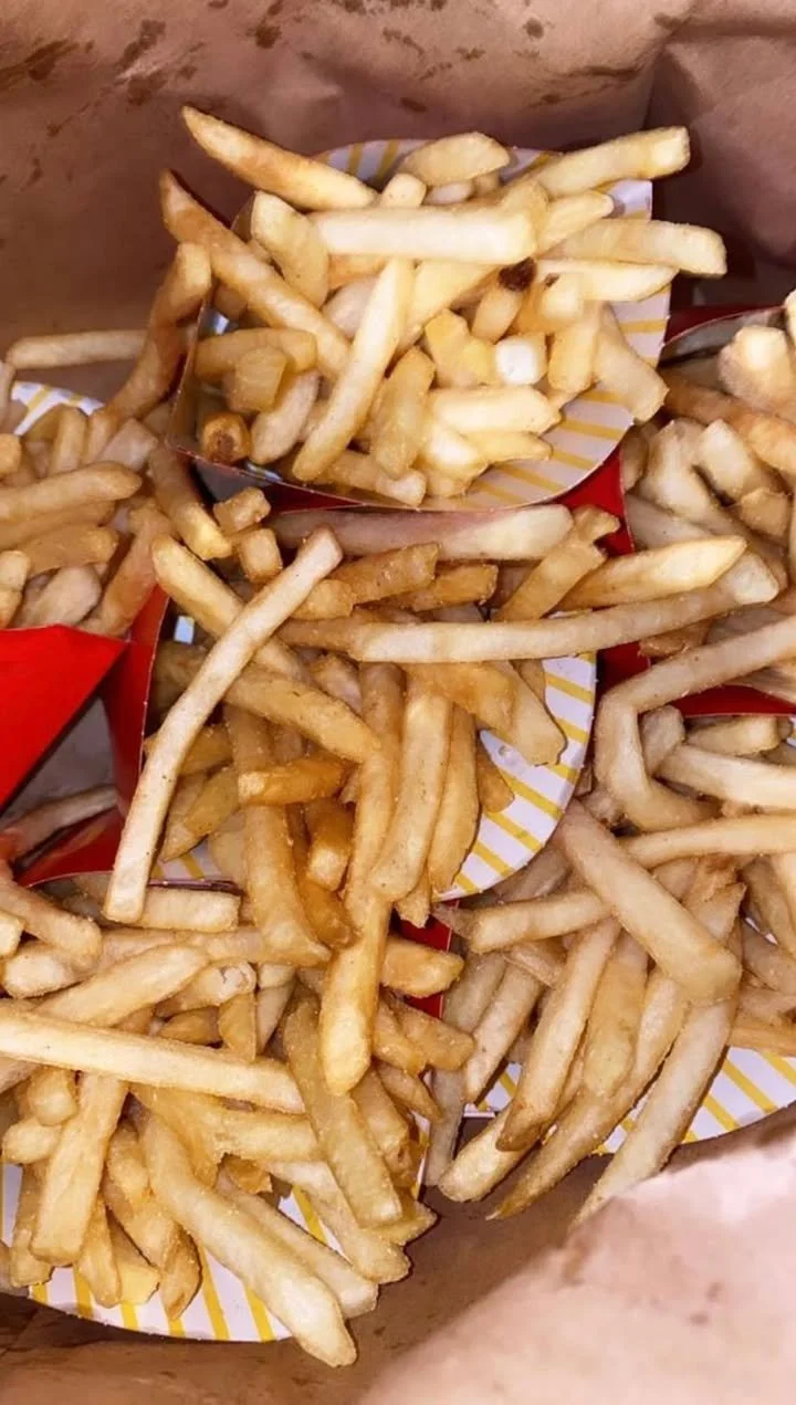 Crispy golden McDonald's French fries served in a red box