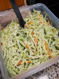 Colorful Mediterranean Garden Slaw with creamy lemon-tahini dressing served in a bowl.