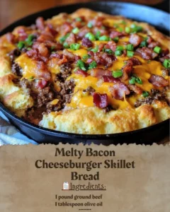 Delicious Melty Bacon Cheeseburger Skillet Bread topped with cheese and crispy bacon.