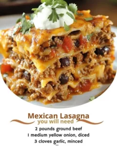 A delicious plate of Mexican taco lasagna with layers of cheese and toppings.