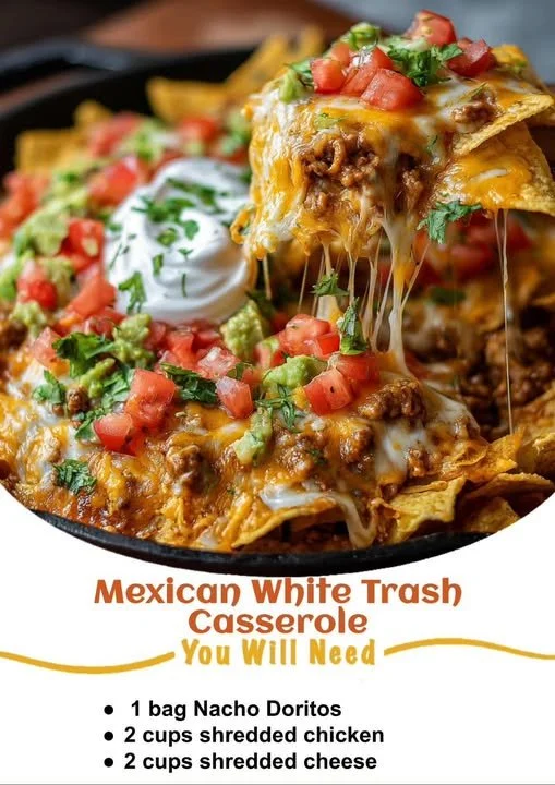 Mexican White Trash Casserole topped with cheese and flavorful ingredients