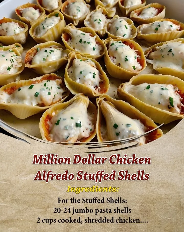 Creamy Million Dollar Chicken Alfredo Stuffed Shells topped with cheese and herbs.