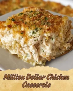 Delicious Million Dollar Chicken Casserole topped with cheese and herbs