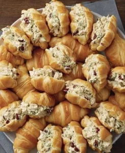 Mini Chicken-Salad Croissants on a platter, ideal for parties and gatherings.
