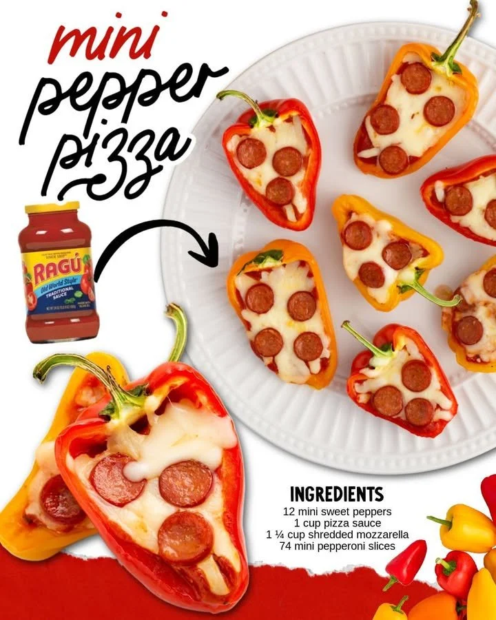 Plate of mini pepper pizzas topped with colorful bell peppers and melted cheese