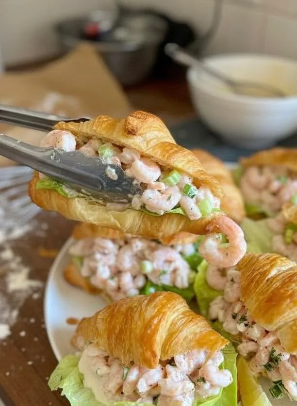 Mini shrimp salad croissant sandwiches with fresh ingredients
