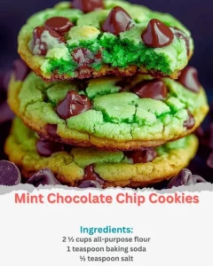 Freshly baked mint chocolate chip cookies on a cooling rack