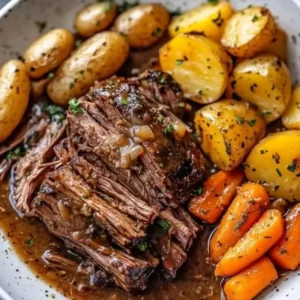 A deliciously cooked Mom's pot roast served with vegetables