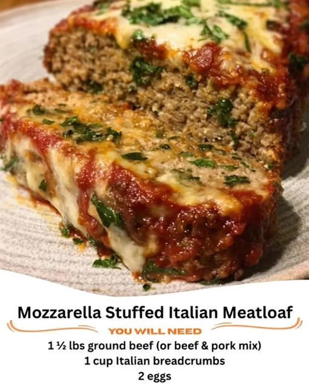 Mozzarella stuffed Italian meatloaf ready to serve with marinara sauce.