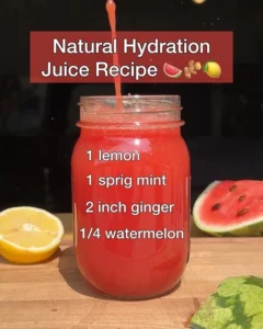 A glass of natural hydration juice filled with fresh fruits and vibrant colors.