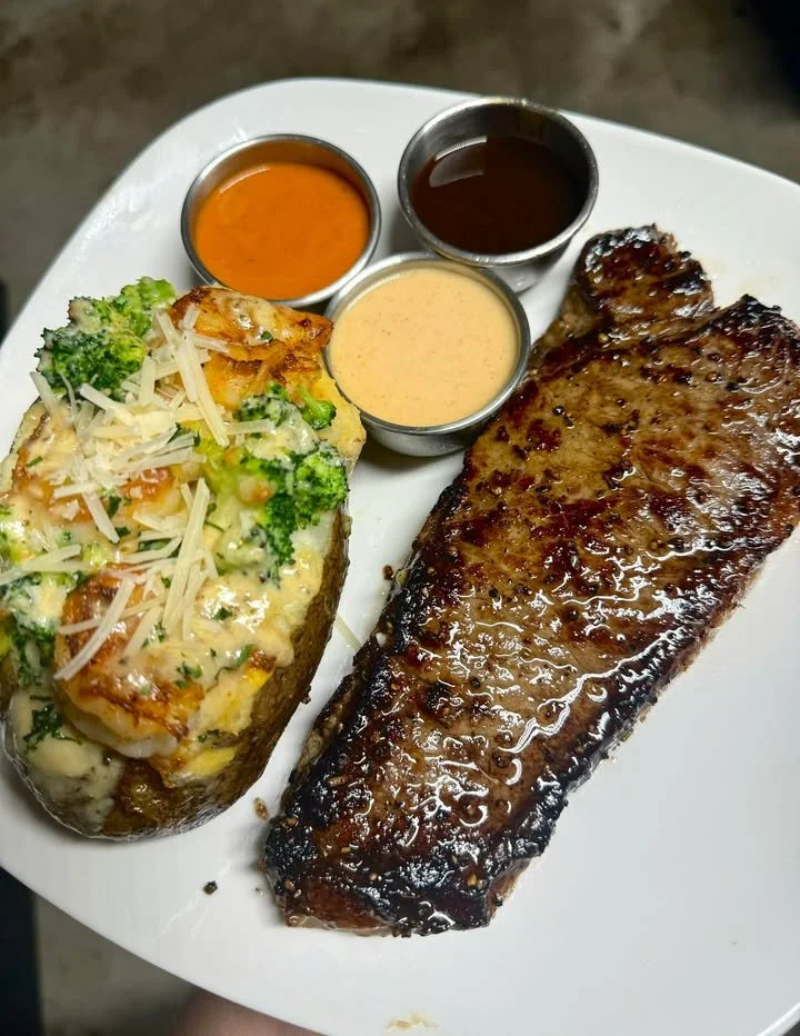 New York Strip and Shrimp Alfredo Baked Potato