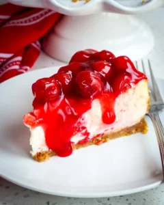 Delicious New York Style cherry cheesecake with a cherry topping