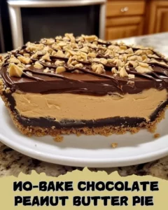 No-Bake Chocolate Peanut Butter Pie topped with chocolate drizzle and peanut butter cups