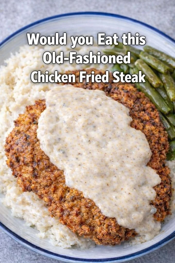 Old-Fashioned Chicken Fried Steak served with gravy and sides