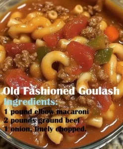 Bowl of Old Fashioned Goulash with pasta and meat, garnished with parsley