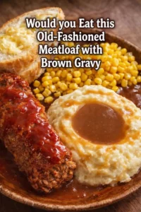 Delicious old-fashioned meatloaf topped with brown gravy served on a plate.